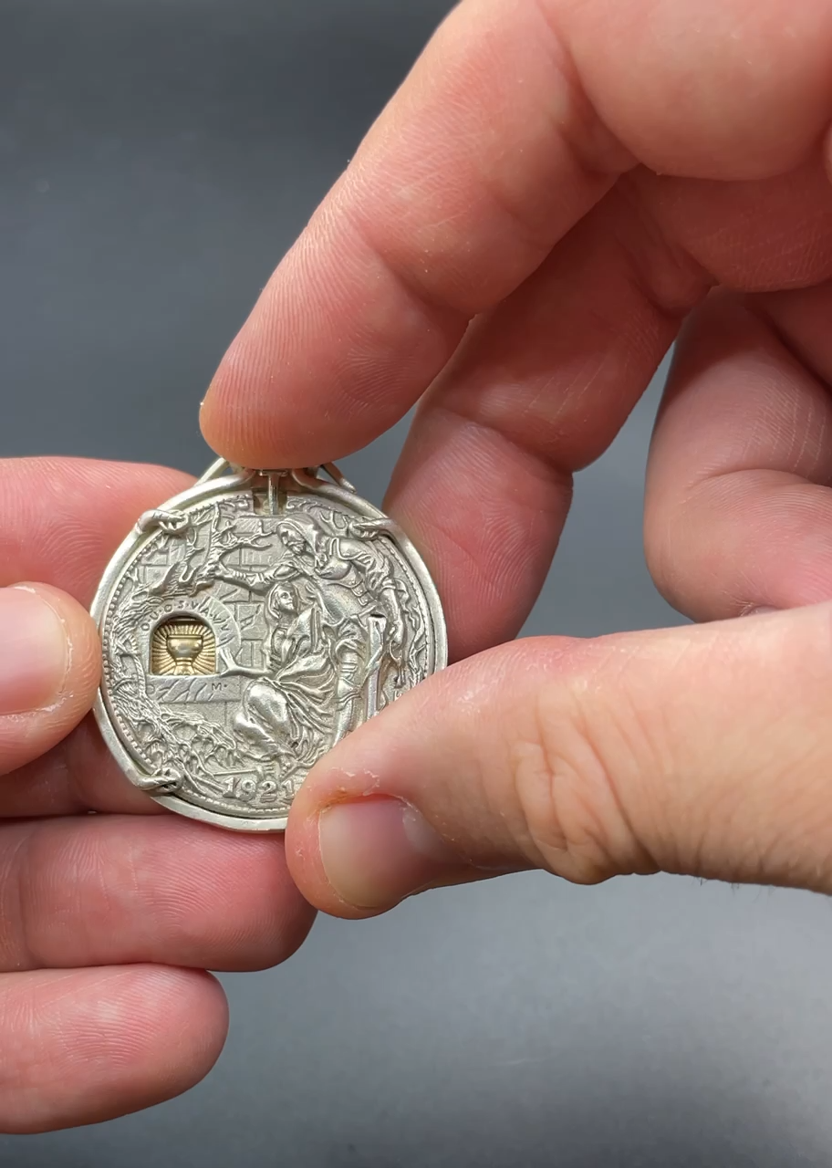 Modified US 1 Dollar Coin with tiny sword that unlocks secret vault - 9GAG