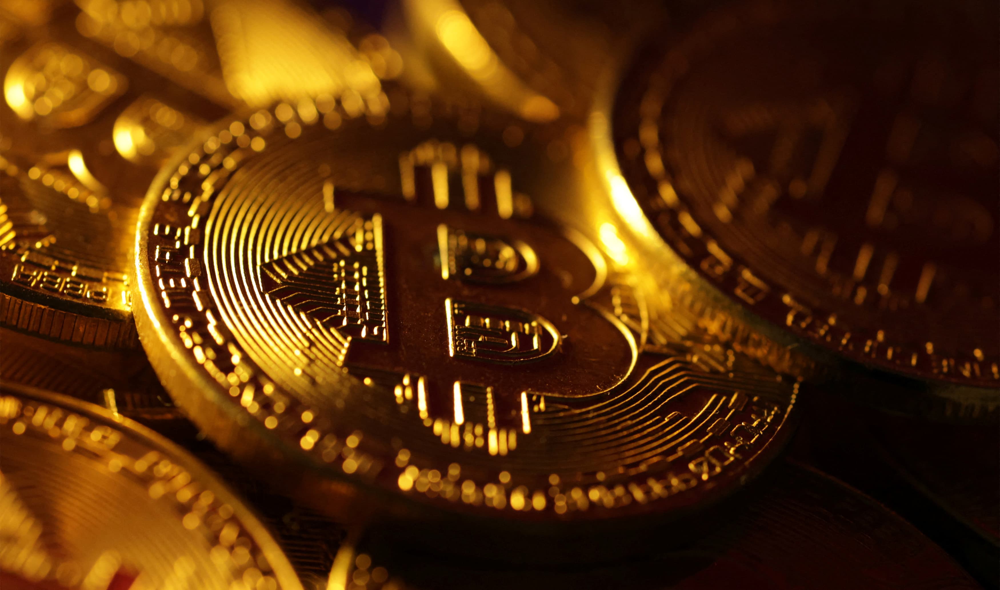 US bitcoin ETFs see $ billion in volume in first day of trading | Reuters